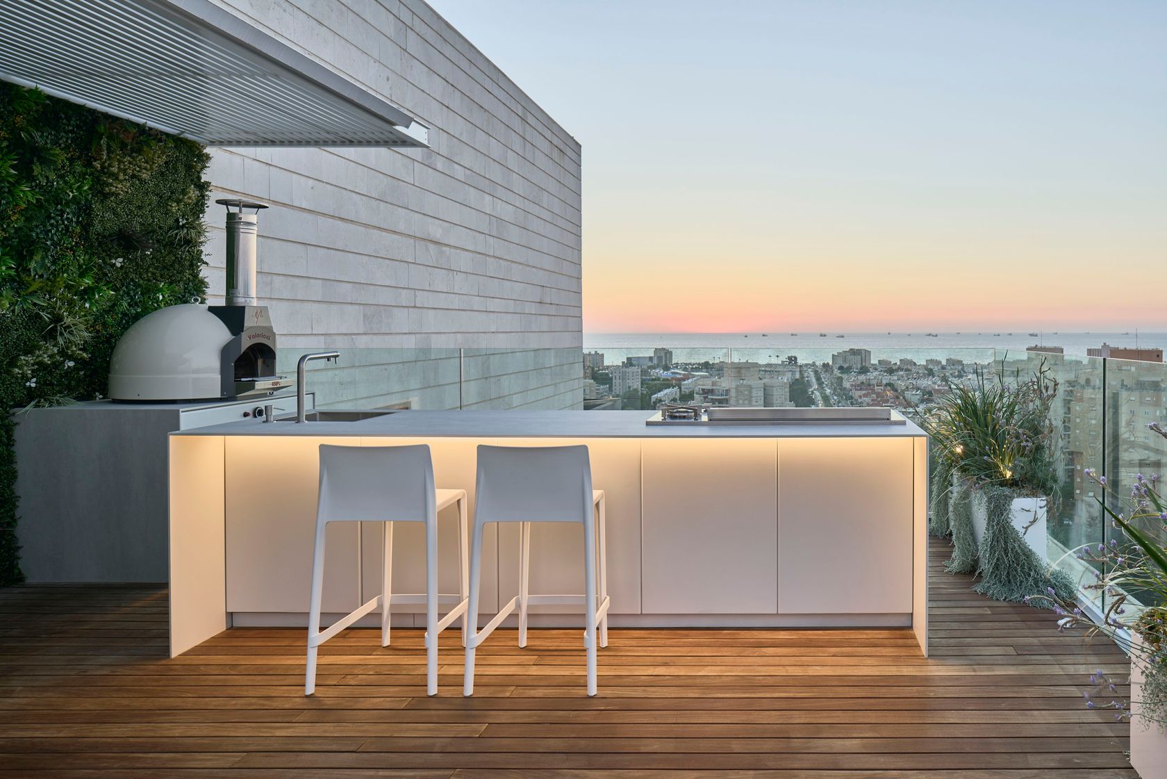UNICA 300 outdoor kitchen on a rooftop at sunset