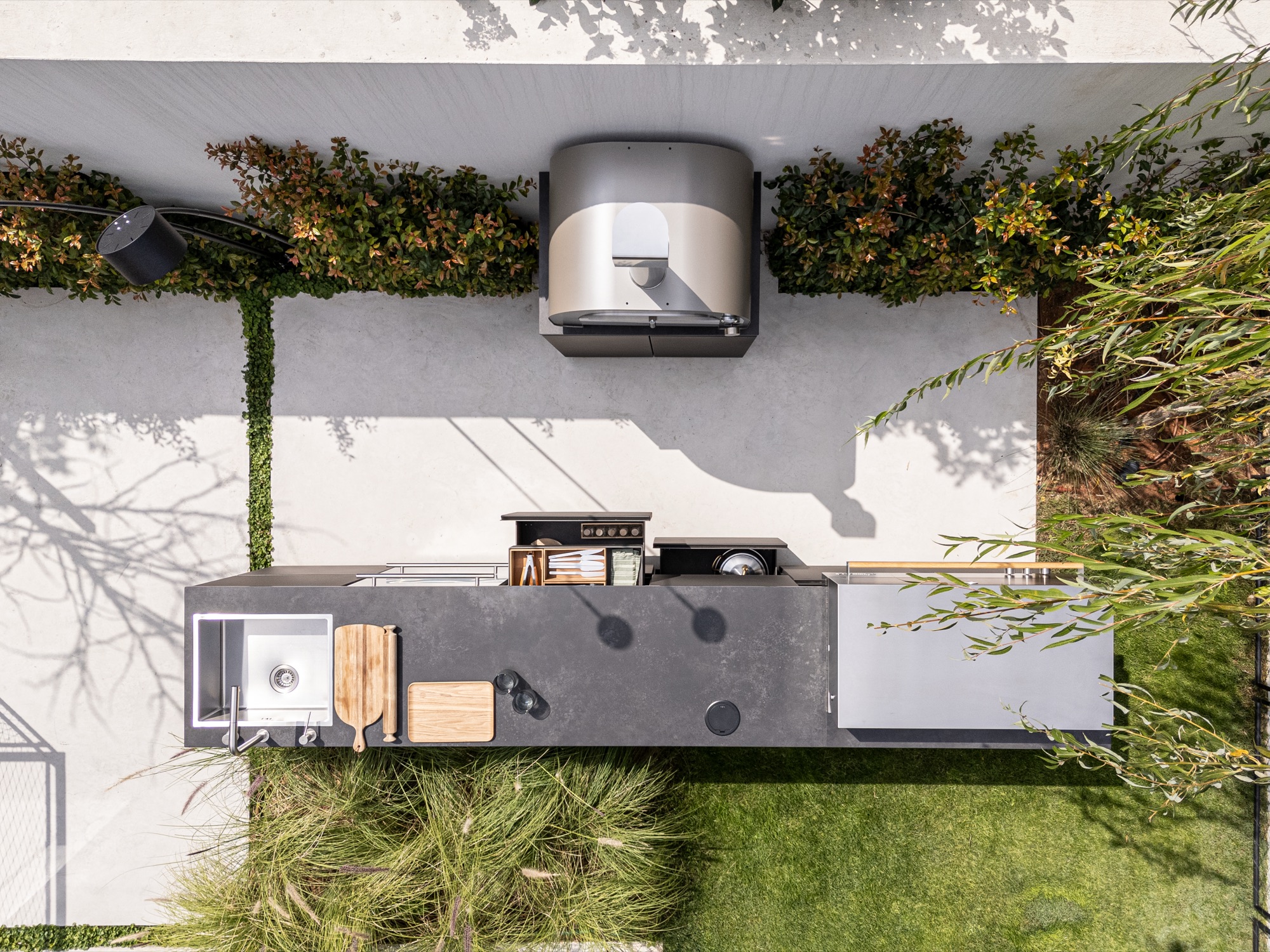 Aerial view of UNICA island with smoker on a white patio