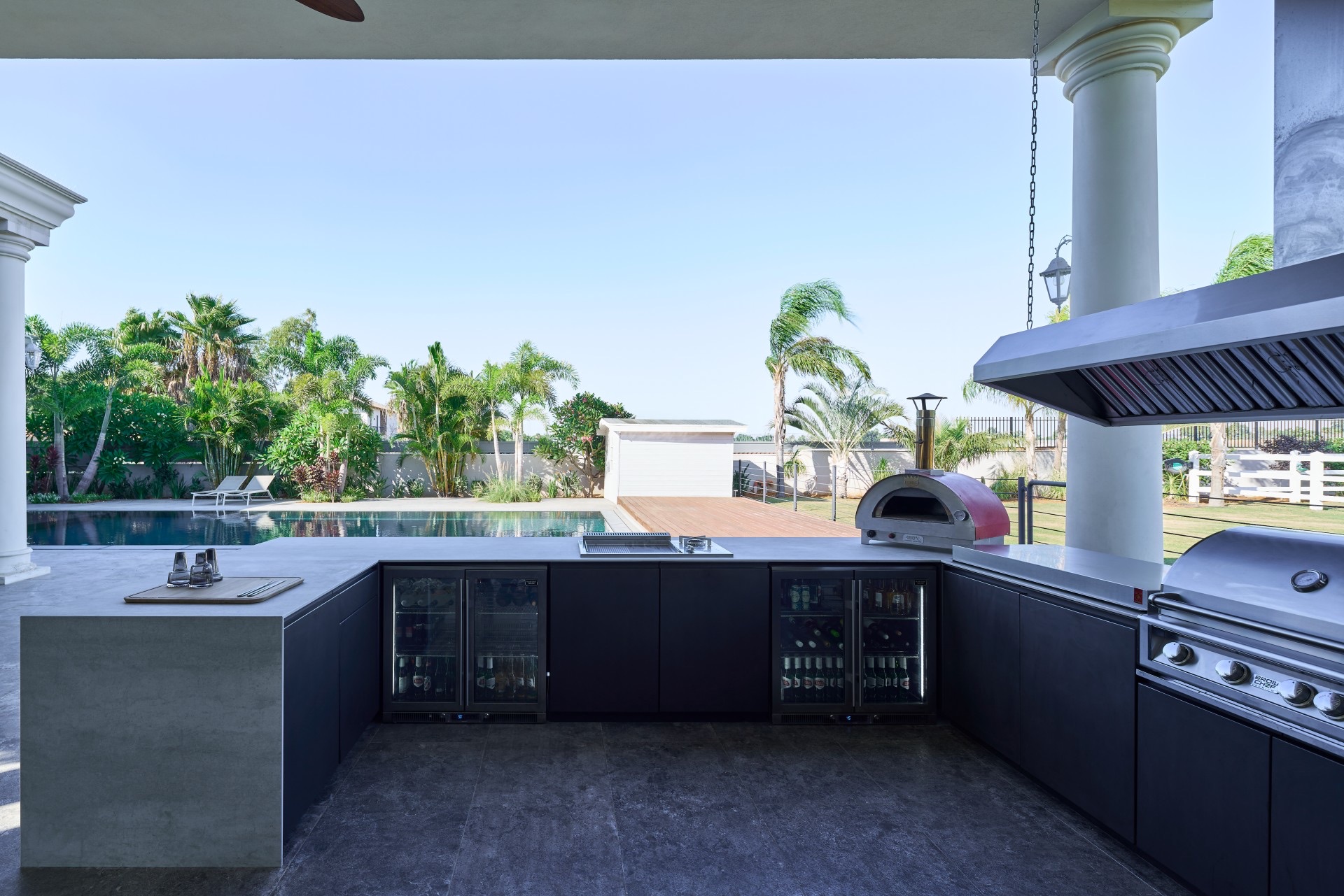 Custom U-shaped dark UNICA kitchen on a colonial porch